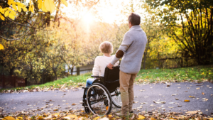 woman in wheelchair in cooler weather with chronic pain